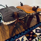 Vintage Hand-Carved Camel Saddle Stools / Ottoman Pair – Solid Wood + Animal Hide