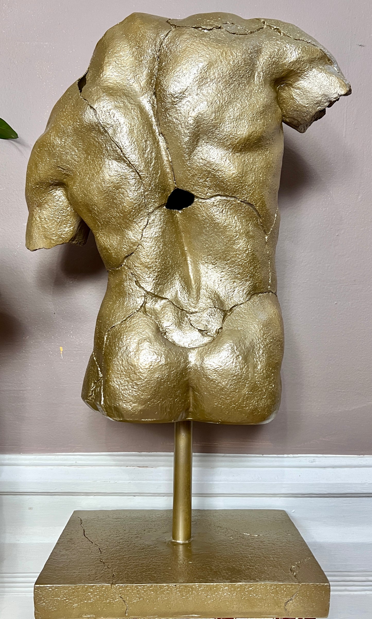 The Golden Torso Statue