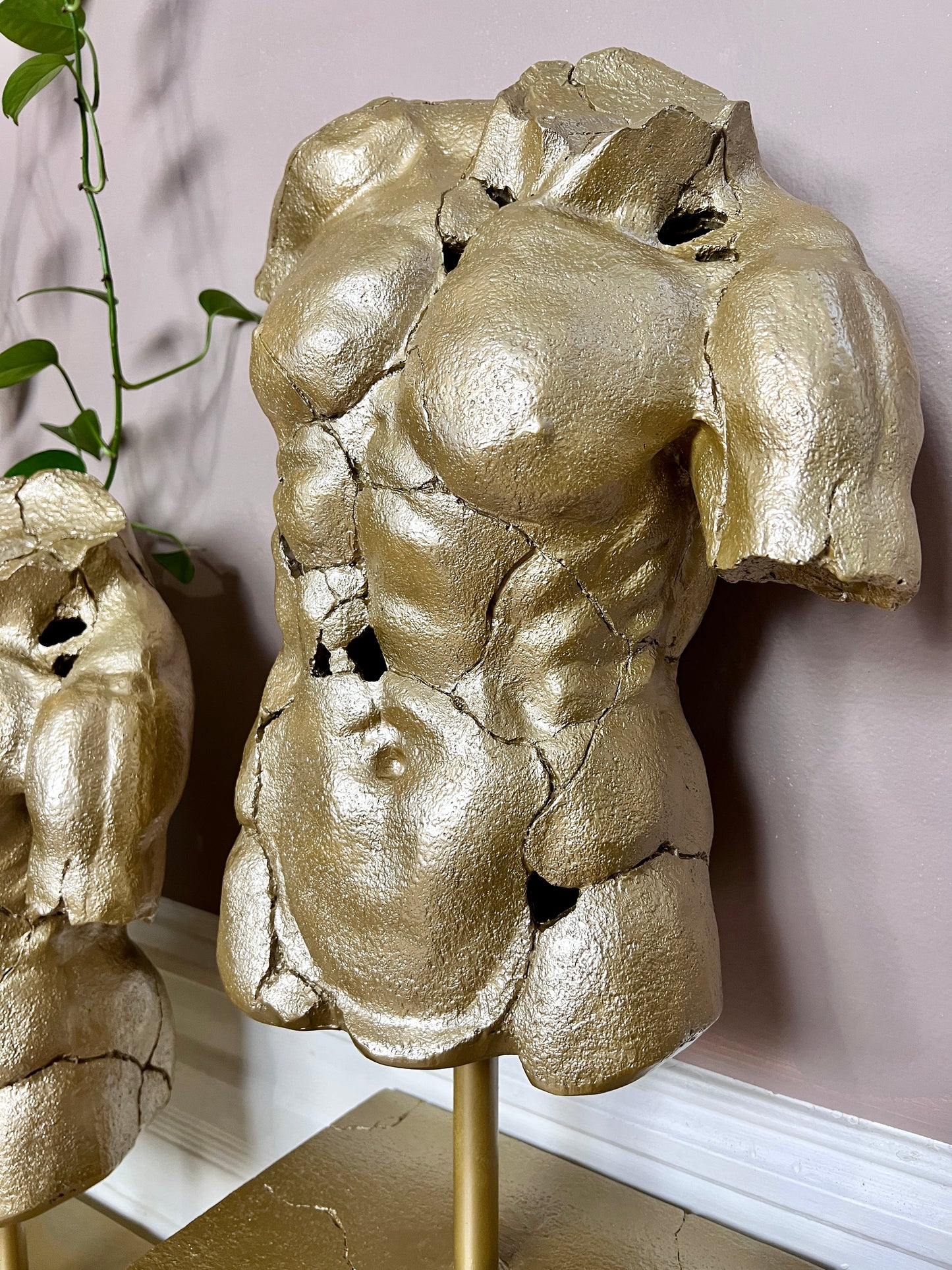The Golden Torso Statue