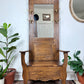 This is an antique oak hall tree bench with mirror, coat hooks & under the seat storage.