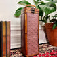 This is a wooden wine box with a lovely purple floral pattern.