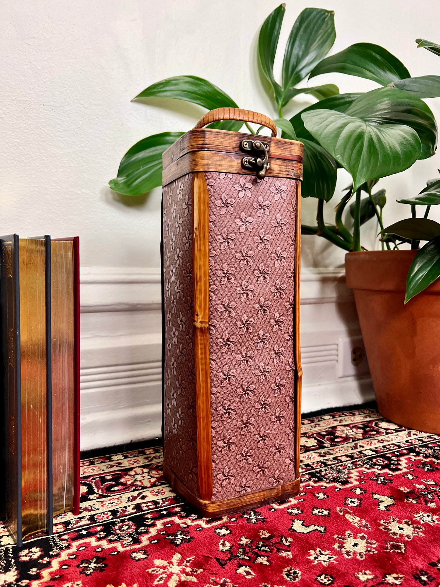 This is a wooden wine box with a lovely purple floral pattern.