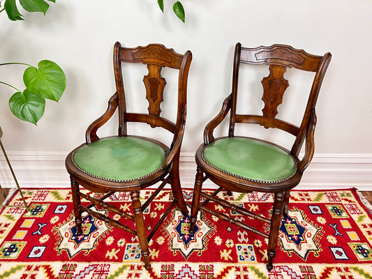 These are antique eastlake chairs with walnut frame and mint green vinyl seats.