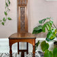 This is a medieval style antique hand carved wooden altar chair in mahogany. 
