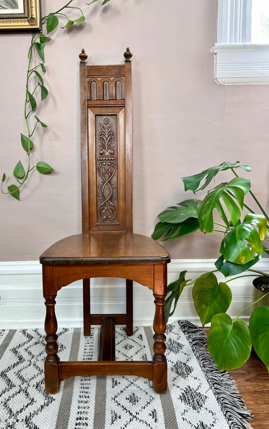This is a medieval style antique hand carved wooden altar chair in mahogany. 