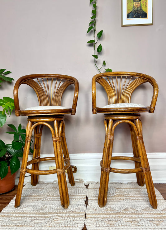 These are vintage honey coloured bentwood bar stools that swivel. 