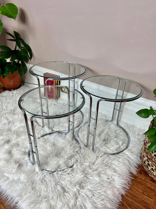 These are 3 glass and chrome circular nesting tables from the 1960s.
