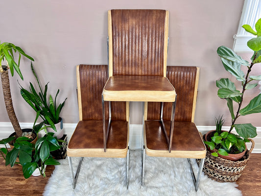 Vintage 1960s brown and custard vinyl upholstery with chrome squared framed legs.