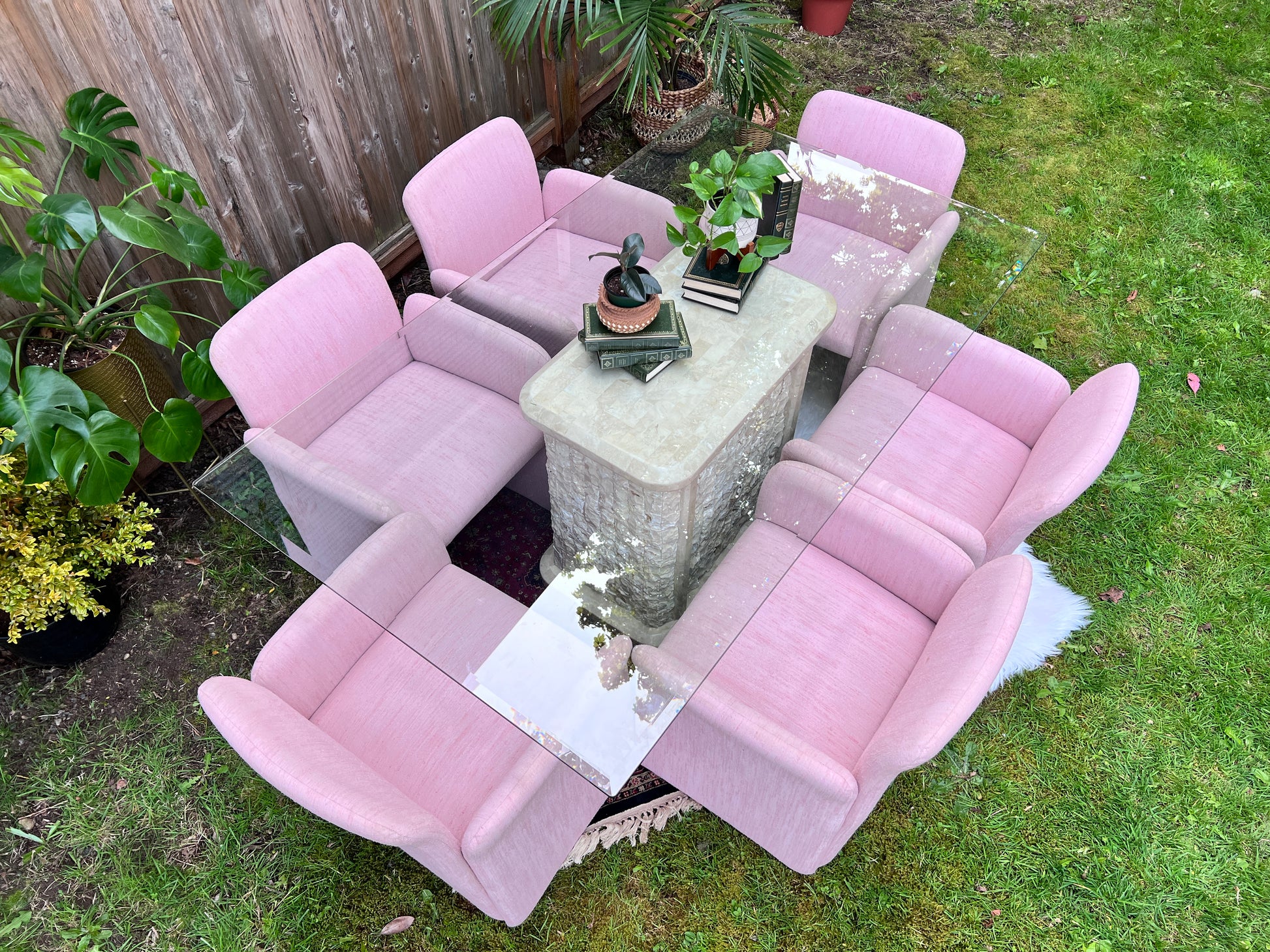 Funky 1980s Glass and marble table with 6 pink chiclet chairs.